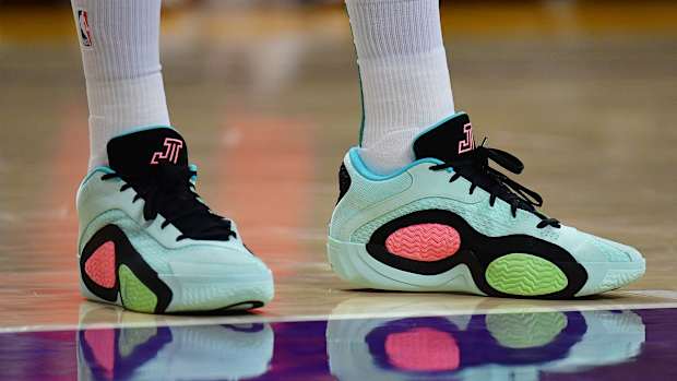 Boston Celtics forward Jayson Tatum's green and black Jordan Brand shoes.